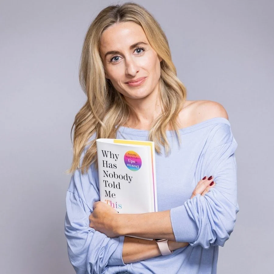 Dr Julie Smith holding her book Why Has Nobody Told Me This Before?
